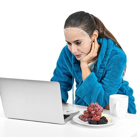 Miss Spa Kale Papaya Cleansing Sheet Mask on Model on computer